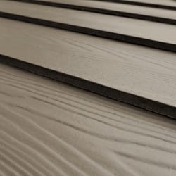 Fiber cement siding that mimics the look of real wood