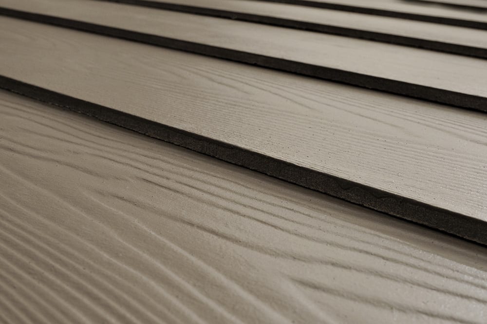 Fiber cement siding that mimics the look of real wood