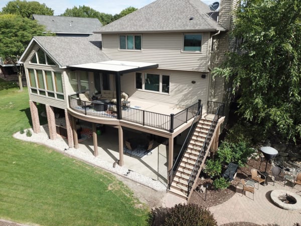 A large three-story home with a multi-level deck.